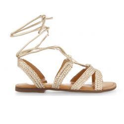 Sandalias planas de piel color dorado trenzadas con cordones