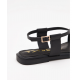 Sandalias planas negras con detalle metalizado